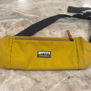 Eddie Bauer 2L Transit Sling Bag antique gold. New with imperfection